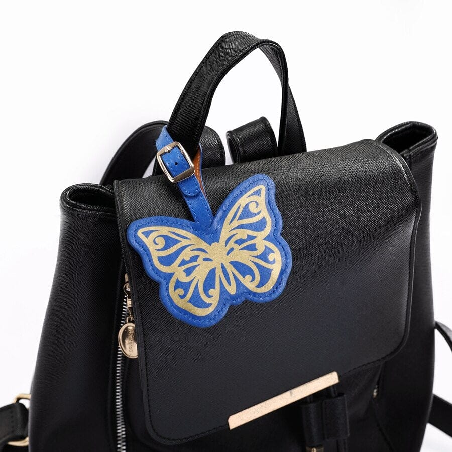 Étiquette Bagage Papillon colorée, idéale pour vos voyages, à attacher facilement sur vos bagages chez Faci.