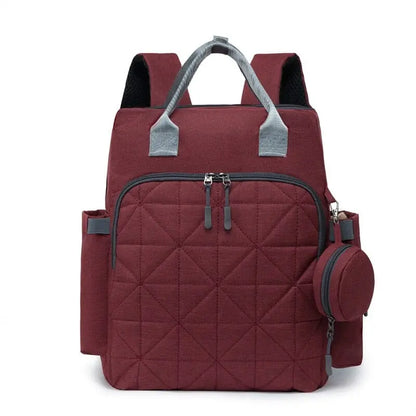 Grand Sac à Dos à langer Broxford rouge, idéal pour ranger biberons et couches lors de vos voyages avec bébé.